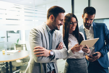 Picture of businesspeople using digital tablet in office