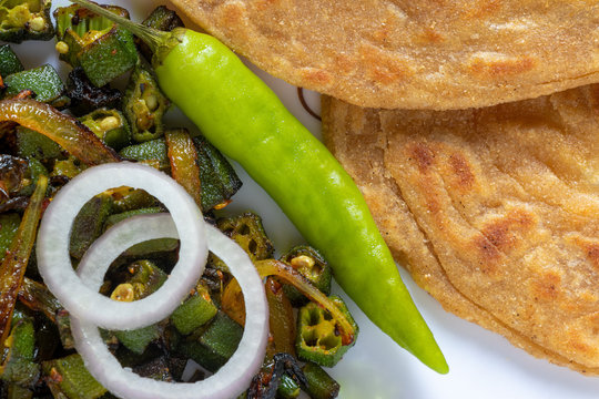 Lachha Paratha, whole wheat layered flat bread with Masala Bhindi (Lady finger) sabzi or Bhaji or recipe.