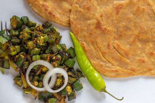 Lachha Paratha, whole wheat layered flat bread with Masala Bhindi (Lady finger) sabzi or Bhaji or recipe.