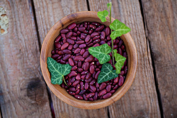 Red beans in bowl on a wooden background