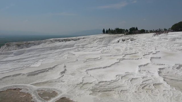 Pamukkale, Denizli, Turkey - 16th of July 2019: 4K Panning calcium formation of sinter terraces