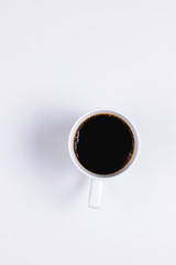 Black coffee in a white cup on a white background