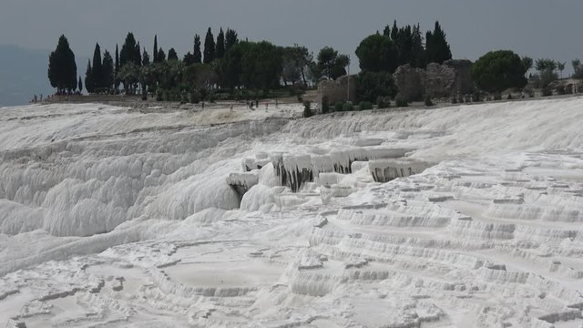Pamukkale, Denizli, Turkey - 16th of July 2019: 4K Zoom out calcium formation of sinter terraces