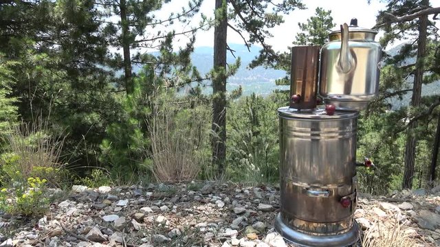 Nif, Mugla, Turkey - 71th of July 2019: 4K Tea making device alfresco in the pine forest
