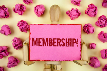 Handwriting text Membership. Concept meaning Being member Part of a group or team Join organization company written Sticky Note paper holding by Wooden Robot Toy plain background Paper Balls.