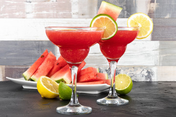 Watermelon smoothie with lime and mint with slices of watermelon.