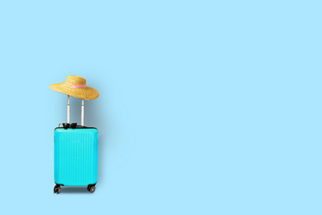Blue suitcase with sunglasses on a blue background