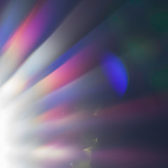 Sunny weather with sparkling beams of light for abstract and dreamy background. Electromagnetic radiation of the natural and visible rays of the sunlight.The seven rainbow colors of the visible light.