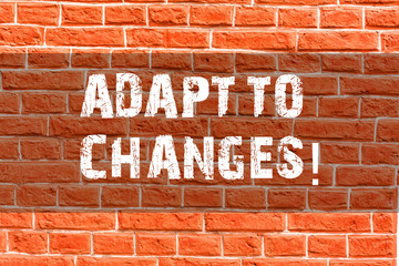 Fototapeta na wymiar Writing note showing Adapt To Changes. Business concept for Innovative changes adaption with technological evolution Brick Wall art like Graffiti motivational call written on the wall
