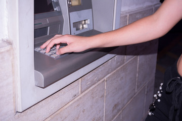 Close Up of Hand That Types a Code on the ATM Panel to Withdraw Cash