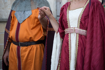 Close Up of Man and Woman Dressed with Medieval Traditional Clothes that Parade at Medieval Village Festival