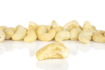 Lot of whole unsalted beige cashew isolated on white background