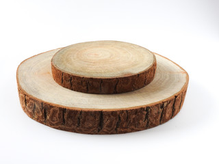 High angle view of two rounded wood slices stacked together isolated on white background. Big and small. With copy space. Nature and wood concept. Wood texture. Tree ring.