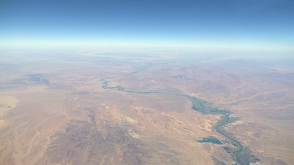 Aerial shot above land and river in 4k