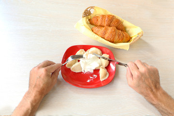 Healthy Eating - On the table are dumplings in a plate and a fork.