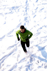 Fototapeta na wymiar Athlete man training at snow