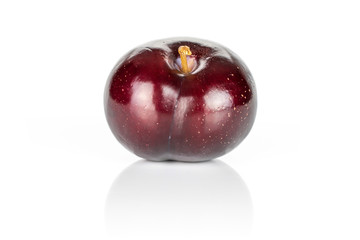 One whole ripe red round plum isolated on white background