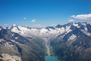 View of a blue lake and glacier in Tirol at the border of Italy and Austria