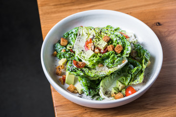 Bowl of salad on table