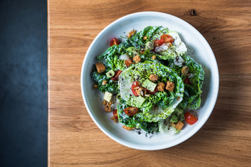 Bowl of salad on table