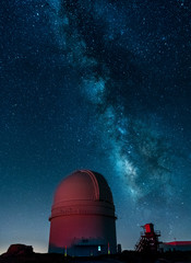 Night landscape of the Milky Way with astronomical obsertary infrastructure. Sky with many stars.