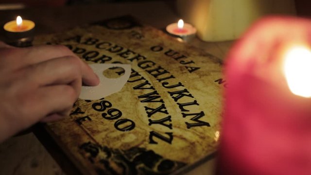 White Male using Ouija Board