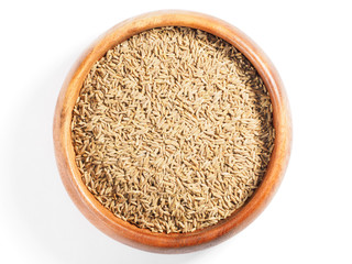 Cumin seeds (Cuminum), Jeera in a wooden cup on a white background