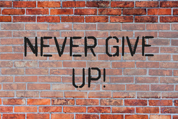 Fototapeta na wymiar Handwriting text Never Give Up. Conceptual photo Be persistent motivate yourself succeed never look back Brick Wall art like Graffiti motivational call written on the wall
