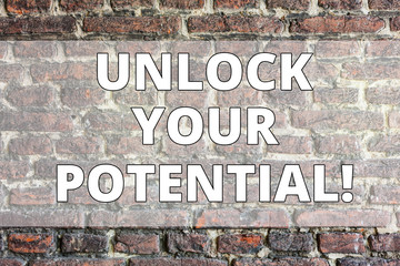 Writing note showing Unlock Your Potential. Business concept for Reveal talent Develop abilities Show demonstratingal skills Brick Wall art like Graffiti motivational call written on the wall