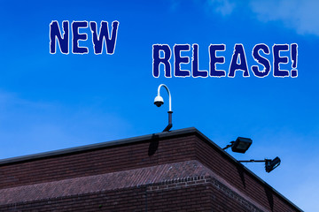 Writing note showing New Release. Business concept for announcing something newsworthy recent...