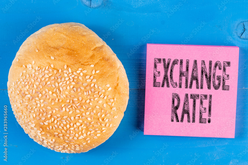 Aufkleber writing note showing exchange rate. business concept for value of one currency for the purpose of co