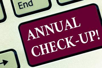 Handwriting text Annual Check Up. Concept meaning Yearly evaluation and demonstrating the health status Keyboard key Intention to create computer message pressing keypad idea