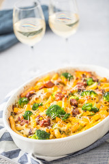 Baked pasta penne with broccoli smoked pork neck mozzarela cheese and othe ingredients