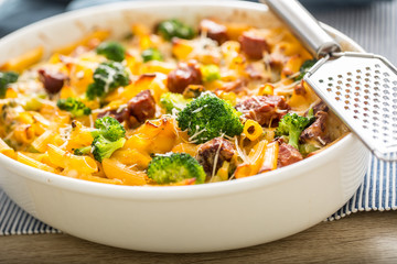 Baked pasta penne with broccoli smoked pork neck mozzarela cheese and othe ingredients