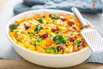 Baked pasta penne with broccoli smoked pork neck mozzarela cheese and othe ingredients