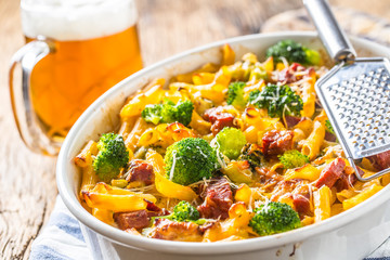Baked pasta penne with broccoli smoked pork neck mozzarela cheese and othe ingredients