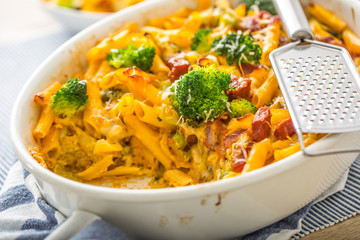 Baked pasta penne with broccoli smoked pork neck mozzarela cheese and othe ingredients