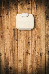 Empty toilet paper roll in very dirty outhouse