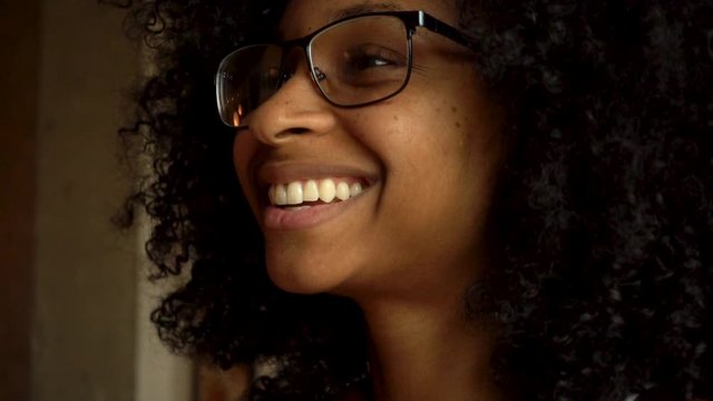 Laughing Black Woman Watching Funny Television Show on Streaming Platform