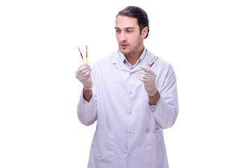 Young handsome doctor with syringe isolated on white