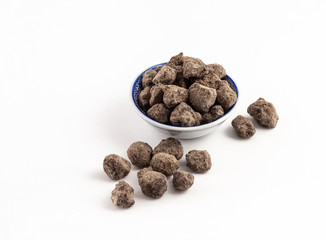 Okinawan black sugar close up on white background