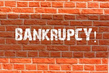 Fototapeta na wymiar Writing note showing Bankrupcy. Business concept for Company under financial crisis goes bankrupt with declining sales Brick Wall art like Graffiti motivational call written on the wall