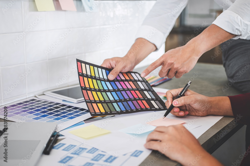 Poster teamwork of creative designers working on new project and choose color swatch samples for selection 