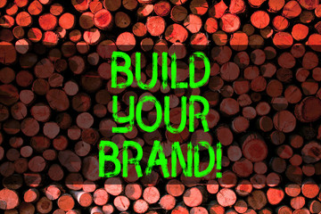 Conceptual hand writing showing Build Your Brand. Concept meaning creates or improves customers knowledge and opinions of product Wooden background vintage wood wild message ideas thoughts