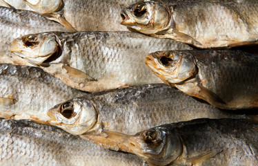 dried salt fish wooden background 