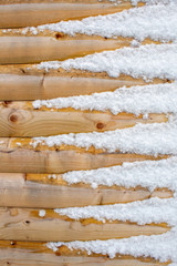 Triangular Pattern of Wooden Planks and Fluffy Snow