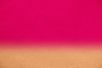 Fototapeta premium Texture of genuine leather. Gentle color leather texture closeup. Colorful background with gradient. Delicate pink color.