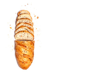 Top view from above - half sliced homemade wheat grain fresh gluten free bread, space for text, isolated on white background. Copyspace. Food concept, flat lay composition