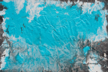 blue watercolor painted on creased paper background texture