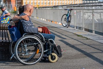 Obraz premium Woman, Man in a Wheelchair